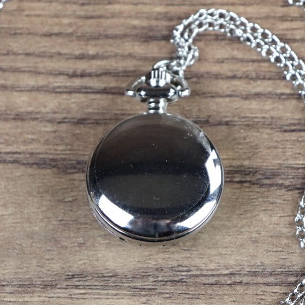 Kleine Taschenuhr, mit emailliertem Blumen Bild in Blau-Weiß